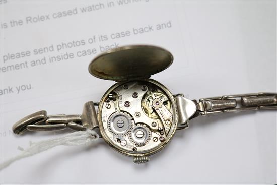 An early 20th century silver manual wind wrist watch in Rolex case and two wrist watches.